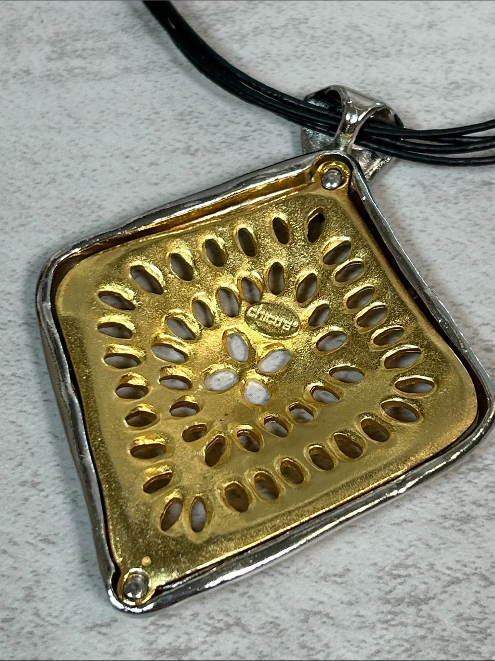 Chico's Gold and Silver Sunburst Pendant Necklace with Black Multi-Strand Cord